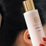 Haarstylingcreme im eleganten Design mit goldener Kappe, ideal für Volumen und Glanz.